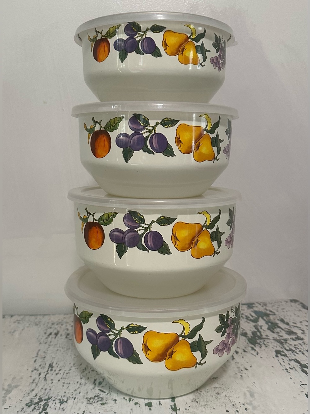 Set of four vintage Essence Tabletops Unlimited bowls with lids.